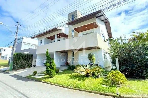 Casa à venda no Campeche, Florianópolis, em condomínio com 5 suítes e lazer completo — foto 1