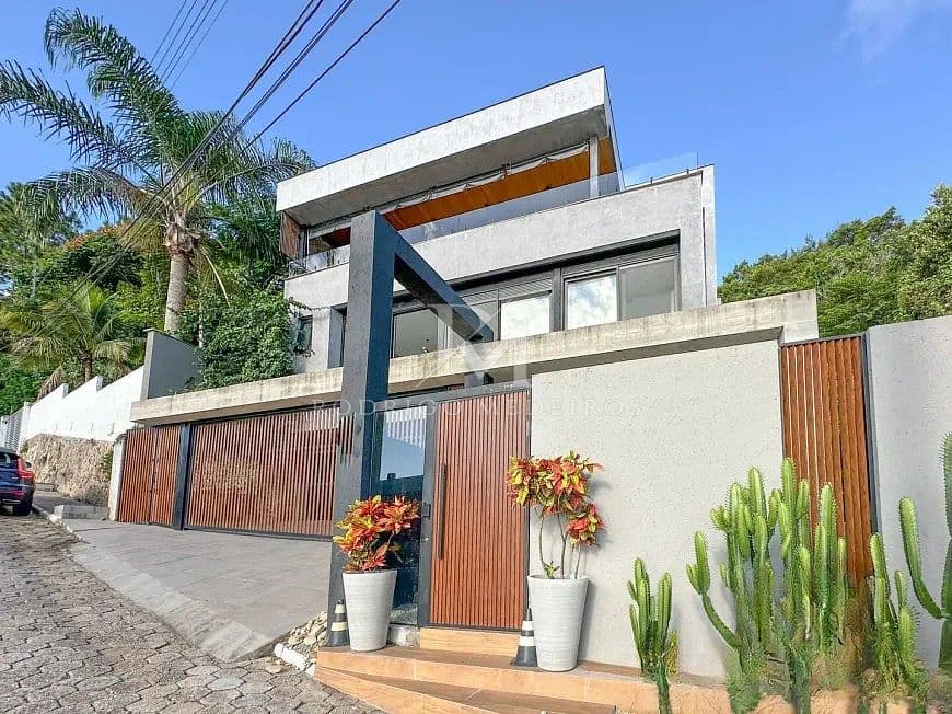 Casa com 3 suítes e vista mar em condomínio no Cacupé/SC — foto 1